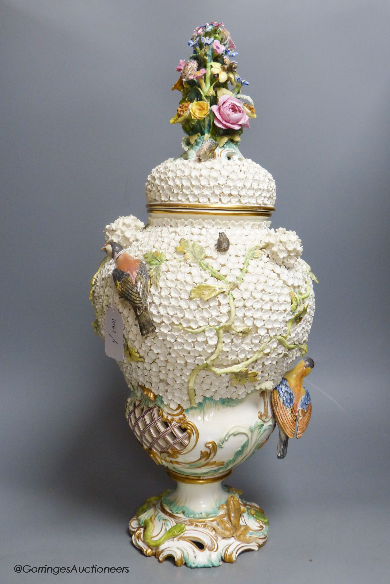 A large 19th century Continental porcelain floral encrusted vase and cover, height 58cm